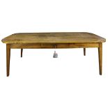 Continental Provincial harvest table, having a shaped rectangular top, above a single drawer, and