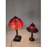 (lot of 2) Lundberg Studios art glass lamps, each having an iridescent shade, one having a domed
