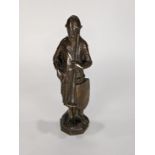 Medieval style patinated bronze sculpture, depicting a knight in armor grasping a trumpet, 11.5"h