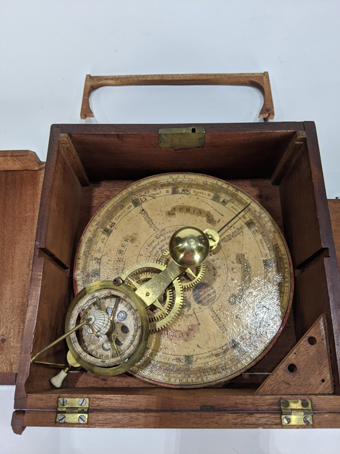 A small English orrery circa 1800, with printed label, "designed for the NEW PORTABLE ORRERY by W.