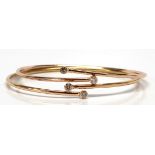 (Lot of 2) Diamond, 14k rose and yellow gold bracelets Including 1) diamond, 14k rose gold bypass