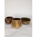 (lot of 3) A Native American basketry group, including a Hupa hat, a polychrome example, together