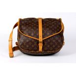 Louis Vuitton Saumur shoulder bag, 30cm, executed in brown Monogram Coated Canvas and having a
