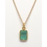 Emerald, 18k yellow gold pendant-necklace Featuring (1) emerald-cut emerald, weighing