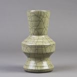 A Chinese Ge-style crackle-galzed porcelain, applied overall with greenish gray glaze, supported