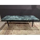 Modern cocktail table, having a green marble top, above ebonized tapered legs, 16"h x 60"w x 24"d