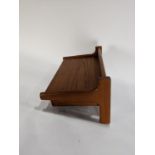 A Danish Modern hanging wall shelf designed by Borge Mogensen (Danish, 1914-1972), having a single