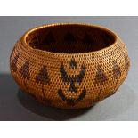 A Native American Indian Washoe coiled basket, Nevada, of bulbous form with continuous triangle