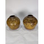 (lot of 2) Southeast Asian glazed pottery oil storage jars, each of ovoid form with stylized figural