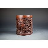 A Chinese carved bamboo 'figural' brush pot, 14H x 12.7W cm