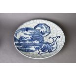 A Chinese export blue and white porcelain charger depicting ancient pagoda in a landscape scenery.