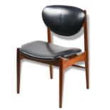 A Danish Modern side chair, having black upholstery and rising on turned legs, 32"h
