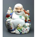 Chinese enameled ceramic figure of the buddha with five children, with Mao jisheng studio mark to