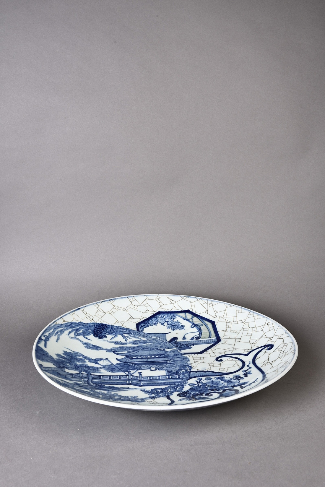 A Chinese export blue and white porcelain charger depicting ancient pagoda in a landscape scenery. - Image 2 of 3