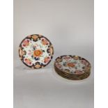 (lot of 7) English Imari pattern plates, each having partial gilt and floral decoration, 9.5"dia.