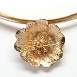 14k yellow gold flower pendant-brooch necklace Featuring (1) 14k yellow gold flower, measuring