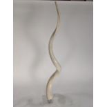 Modern resin sculpture in the form of a spiral horn, rising on an acrylic base, 37"h Provenance: