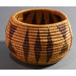 An American Indian Washoe coiled basket, Nevada, of bulbous form with continuous triangle and