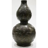 A Chinese bronze double gourd vase, overall body incised with gourds, leaves and butterflies, a