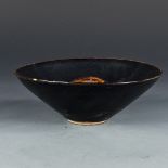A Chinese Jizhou style leaf bowl, of conical form with wide flaring sides rising from a short