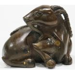 A carved Chinese bronze recumbent ram, base carved with six-character mark size: 2.75"h