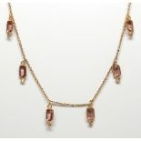 Tourmaline, diamond, 18k yellow gold necklace Featuring (10) rectangular-cut pink tourmalines,