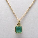 Emerald, 18k yellow gold pendant-necklace Featuring (1) emerald-cut emerald, weighing