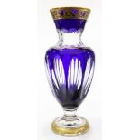 A Saint Louis, France crystal vase, having a gilt rim, above a cobalt to clear body, underside