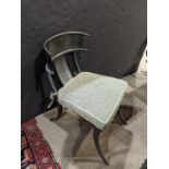 A Michael Taylor patinated Klismos chair, having a contoured crest above the single splat, the