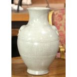 A guan style crackle vase, of ovoid body shape and flanked by a pair of elephant ring handles, a six