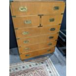Baker campaign style tall chest, having a rectangular top, above sever drawers, 47"h x 34"w x 19"d