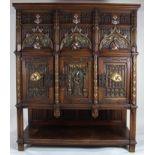 A French hand carved and polychrome decorated oak Gothic Revival cabinet circa 1850