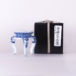 A Chinese blue and white tripod porcelain censer base
