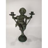 A Patinated metal candelabra in the Renaissance taste