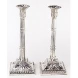 A pair of George III sterling weighted candlesticks