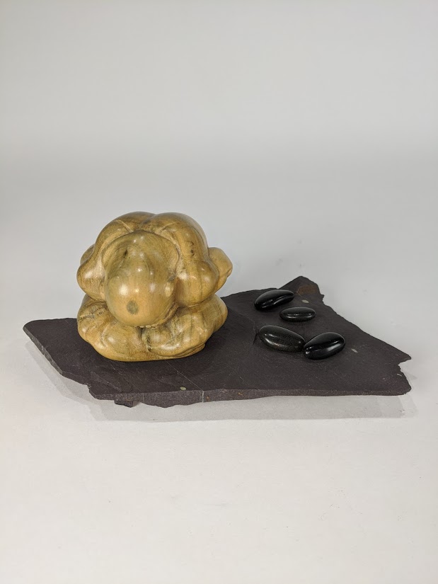 A Japanese Modern carved wood figure of a seated couching man - Image 3 of 8