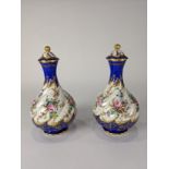 A Pair of Continental porcelain lidded vases