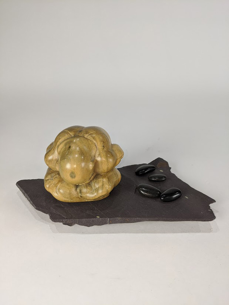 A Japanese Modern carved wood figure of a seated couching man - Image 2 of 8