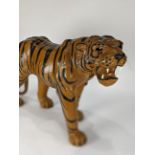 Papier mache figure of a walking tiger