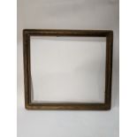 An Arts and Crafts giltwood carved picture frame