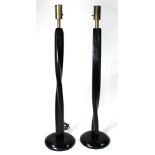 A pair of Modern ebonized and carved floor lamps circa 1970