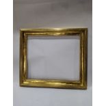 An Arts and Crafts Newcomb Macklin giltwood carved picture frame