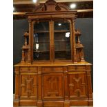 A monumental American Victorian Renaissance Revival parlor cabinet circa 1870