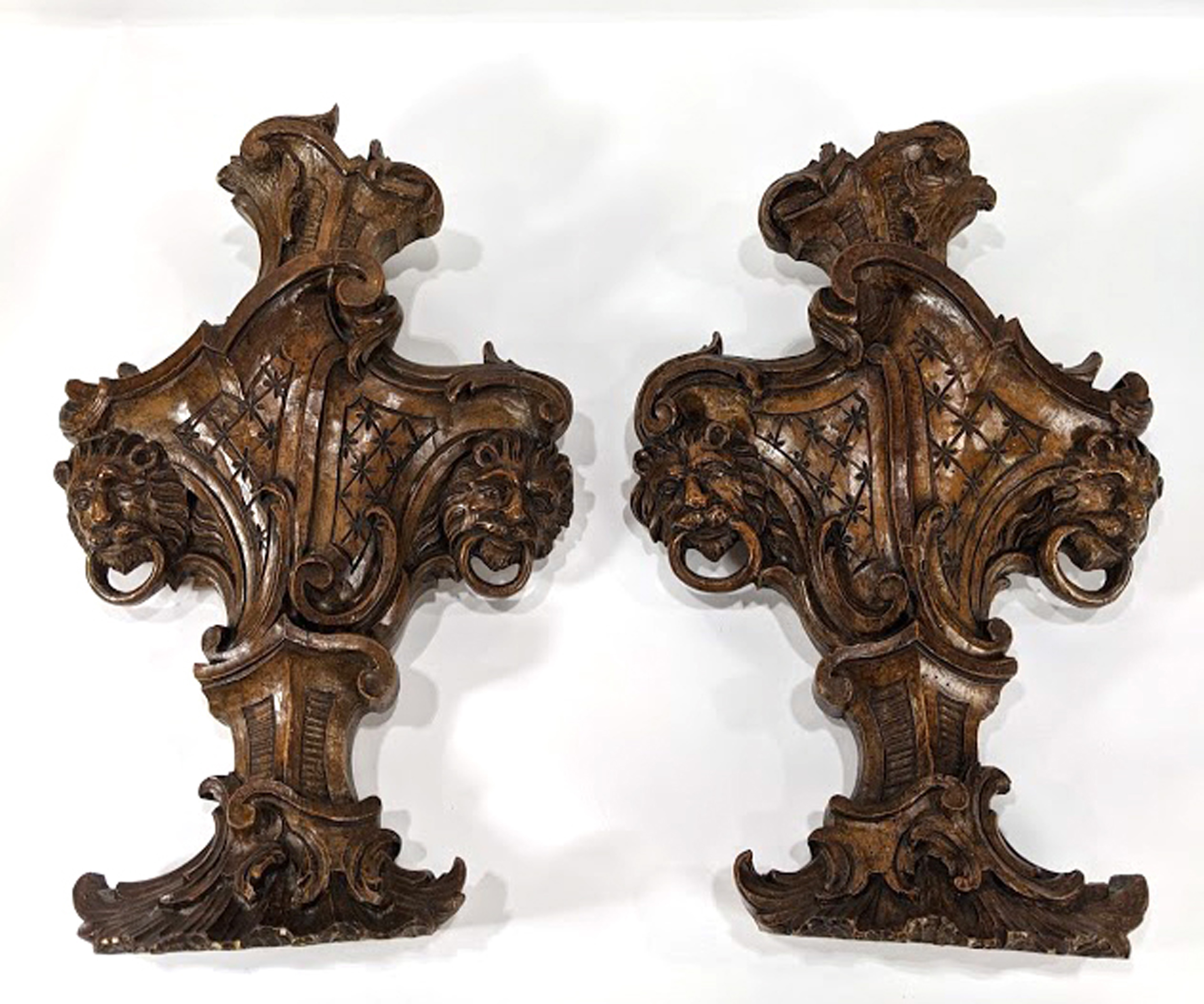 A pair of German Rococo carved walnut balustrade segments