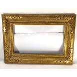 A custom giltwood carved plein air picture frame