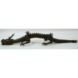 A Japanese carved Fruitwood articulated dragon Meiji Period (Late 19th century)