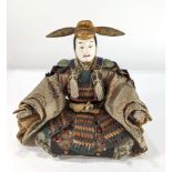 A Japanese polychrome decorated doll depicting a Shogun