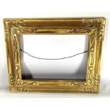 A custom giltwood carved plein air picture frame