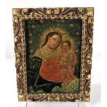 A Spanish Colonial School retablo depicting the Mother and Child