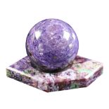 A Russian charoite specimen sphere on stand, Sakha Republic, Eastern Siberia